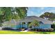 Charming single-story home featuring a beautiful tiled roof and well-manicured front yard at 9159 Highland Ridge Way, Tampa, FL 33647