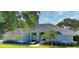 Charming single-story home featuring a beautiful tiled roof and well-manicured front yard at 9159 Highland Ridge Way, Tampa, FL 33647