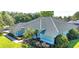Charming single-story home featuring a beautiful tiled roof and well-manicured front yard at 9159 Highland Ridge Way, Tampa, FL 33647