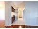 Tiled hallway featuring a bar counter on the left and access to other rooms at 9159 Highland Ridge Way, Tampa, FL 33647