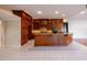 Gourmet kitchen with custom wood cabinetry, granite counters, and a center island at 9159 Highland Ridge Way, Tampa, FL 33647