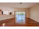 Spacious living area featuring sliding glass doors that offer views of the private pool at 9159 Highland Ridge Way, Tampa, FL 33647
