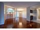 Spacious living room features hardwood floors, a clear view of the entry, and a bar counter at 9159 Highland Ridge Way, Tampa, FL 33647