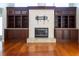 Cozy living room with a fireplace, custom built-ins, and granite countertop accents at 9159 Highland Ridge Way, Tampa, FL 33647