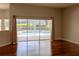 Spacious living area featuring sliding glass doors that offer views of the private pool at 9159 Highland Ridge Way, Tampa, FL 33647