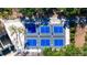 Aerial view of multiple blue pickleball courts surrounded by lush greenery at 9159 Highland Ridge Way, Tampa, FL 33647