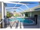 Screened-in pool with tile and safety fence at 9159 Highland Ridge Way, Tampa, FL 33647
