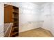 Large walk-in closet featuring custom shelving for optimal storage and organization at 9159 Highland Ridge Way, Tampa, FL 33647