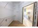 Large walk-in closet with custom shelving, leading into a bright and spacious bathroom at 9159 Highland Ridge Way, Tampa, FL 33647