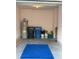 Garage features water heater, trash receptacles, paint, and a blue rug at 9508 Ashburn Creek Ln, Tampa, FL 33610