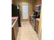Efficient kitchen featuring stainless steel appliances and a neutral color scheme at 9508 Ashburn Creek Ln, Tampa, FL 33610