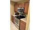 Efficient kitchen with stainless steel oven, microwave and cooktop at 9508 Ashburn Creek Ln, Tampa, FL 33610