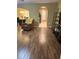 Inviting living area with hardwood floors and seamless flow to the dining area at 9508 Ashburn Creek Ln, Tampa, FL 33610