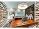 Modern design center with a large table, displays, and plenty of natural light at 9684 Minnow Ray Dr, Land O Lakes, FL 34638
