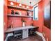 Stylish office space with a shared desk, modern lighting, and decor at 9684 Minnow Ray Dr, Land O Lakes, FL 34638