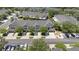 An aerial view captures the community's well-maintained townhomes, landscaping, and parking at 10212 Westpark Preserve Blvd, Tampa, FL 33625