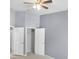 Bedroom features neutral carpet, paint, and trim, and has two closets at 10212 Westpark Preserve Blvd, Tampa, FL 33625