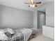 This bedroom features neutral paint, carpet, and a large bed, and a large closet at 10212 Westpark Preserve Blvd, Tampa, FL 33625