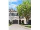 Charming home with gray exterior, dark shutters and a well manicured lawn at 10212 Westpark Preserve Blvd, Tampa, FL 33625