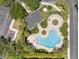 Bird's-eye view of community pool showcasing ample seating, attractive landscaping, and inviting design at 10212 Westpark Preserve Blvd, Tampa, FL 33625