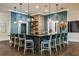 Clubhouse bar with granite counters, brick, decor, pendant lights, bar seating, and hardwood floors at 10865 Rustic Eve Ct, Land O Lakes, FL 34638