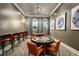 Clubhouse game room features gaming tables, leather chairs, and stylish decor at 10865 Rustic Eve Ct, Land O Lakes, FL 34638
