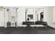 Workout area provides a complete fitness experience with various weight machines, benches, and mirrors at 10865 Rustic Eve Ct, Land O Lakes, FL 34638