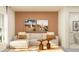 Comfortable living room with neutral tones, sofa, and artwork in a warm setting at 10865 Rustic Eve Ct, Land O Lakes, FL 34638