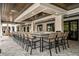 Stylish outdoor bar with patterned tile, seating, and wood ceiling details at 10865 Rustic Eve Ct, Land O Lakes, FL 34638