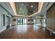 Spacious studio room featuring hardwood floors, natural light, and decorative ceiling at 10865 Rustic Eve Ct, Land O Lakes, FL 34638