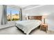 Bright bedroom with a large window, city views, neutral color palette, and wood bedside tables at 111 N 12Th St # 1502, Tampa, FL 33602