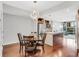 Dining area with modern lighting open to kitchen with stainless appliances, island, and views at 111 N 12Th St # 1502, Tampa, FL 33602