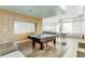 This luxurious game room is equipped with a pool table, ping pong, modern lighting, and comfortable seating at 111 N 12Th St # 1502, Tampa, FL 33602