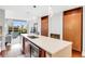 Modern kitchen featuring an island with quartz countertop, stainless steel appliances and hardwood floors at 111 N 12Th St # 1502, Tampa, FL 33602