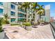 Rooftop deck featuring palm trees, greenery, hardscaping, and outdoor seating for all residents at 111 N 12Th St # 1502, Tampa, FL 33602