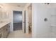 Modern bathroom featuring a shower and vanity with double sinks at 12466 Gust Ct, Hudson, FL 34669