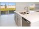 Kitchen with an island, stainless steel appliances, and backyard view at 12466 Gust Ct, Hudson, FL 34669