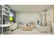 Modern living room with a comfortable sectional sofa, dedicated desk, and stylish decor, perfect for relaxation at 13132 Goldstone Ct, Wimauma, FL 33598