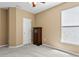 Bedroom with carpeting features an armoire and window at 13312 Tiger Lilly Ln, Tampa, FL 33625