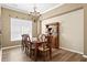 Elegant dining room with hardwood floors, traditional furnishings, and a stylish chandelier at 13312 Tiger Lilly Ln, Tampa, FL 33625