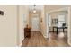 Inviting foyer featuring hardwood floors, classic molding, and an adjacent home office space at 13312 Tiger Lilly Ln, Tampa, FL 33625