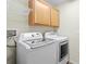 Convenient laundry room with modern, energy efficient washer and dryer at 13312 Tiger Lilly Ln, Tampa, FL 33625