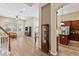Spacious living room with hardwood floors and plenty of natural light from large windows at 13312 Tiger Lilly Ln, Tampa, FL 33625