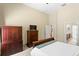 Spacious main bedroom featuring a high ceiling, carpet, and dark wood furniture at 13312 Tiger Lilly Ln, Tampa, FL 33625