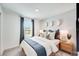 Bedroom with neutral tones, a comfortable bed, and natural light from a large window at 13357 Tropical Breeze Way, Hudson, FL 34669
