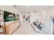 Bright loft area with comfortable seating, media console, and lots of space at 13357 Tropical Breeze Way, Hudson, FL 34669