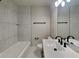 This bathroom features modern finishes with a tiled shower and updated vanity at 1361 Overlea St, Clearwater, FL 33755