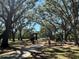 Plenty of fun to be had in this neighborhood park with playgrounds and picnic tables shaded by mature trees at 1428 Chesterfield Dr, Dunedin, FL 34698