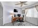 Functional office space with a large desk setup, perfect for remote work or studying at 1428 Chesterfield Dr, Dunedin, FL 34698