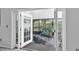 View from living room to the screened patio at 1428 Chesterfield Dr, Dunedin, FL 34698